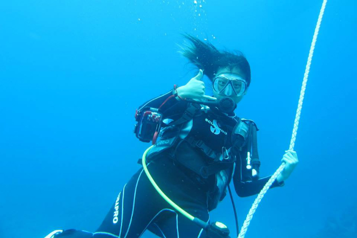 Girl Scuba Diving Smiling for Camera - Lost at Sea