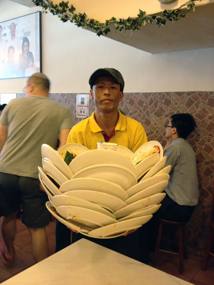 Saw A Waiter Clearing Plates At A Local Restaurant